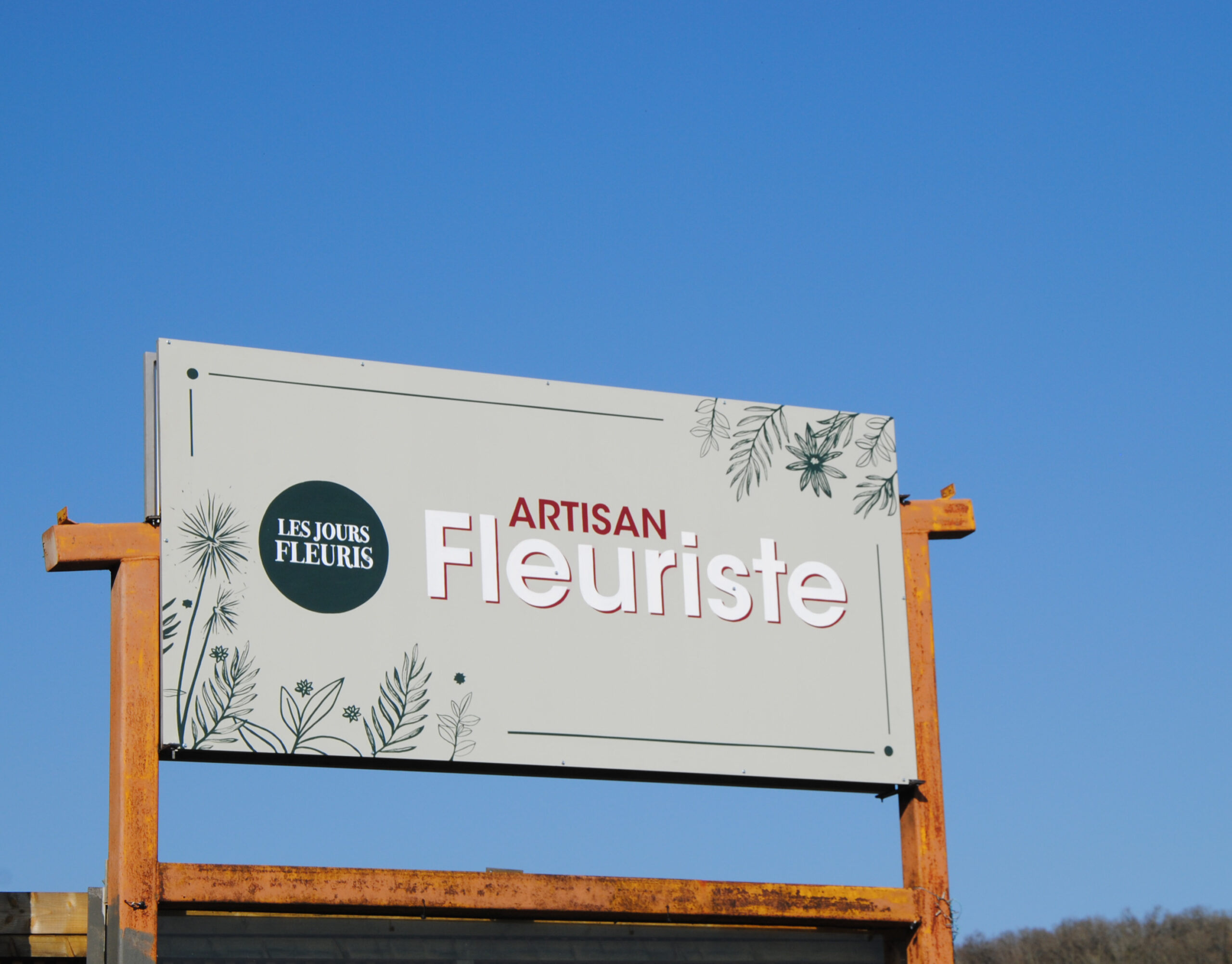Enseigne commerciale peinte pour une fleuriste à Saint Michel Loubejou dans le Lot